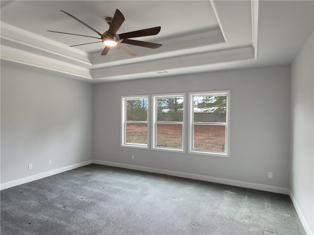 908 West Union Grove Circle Auburn, GA 30011 - Photo 10 of 16 an empty room with a ceiling fan and window