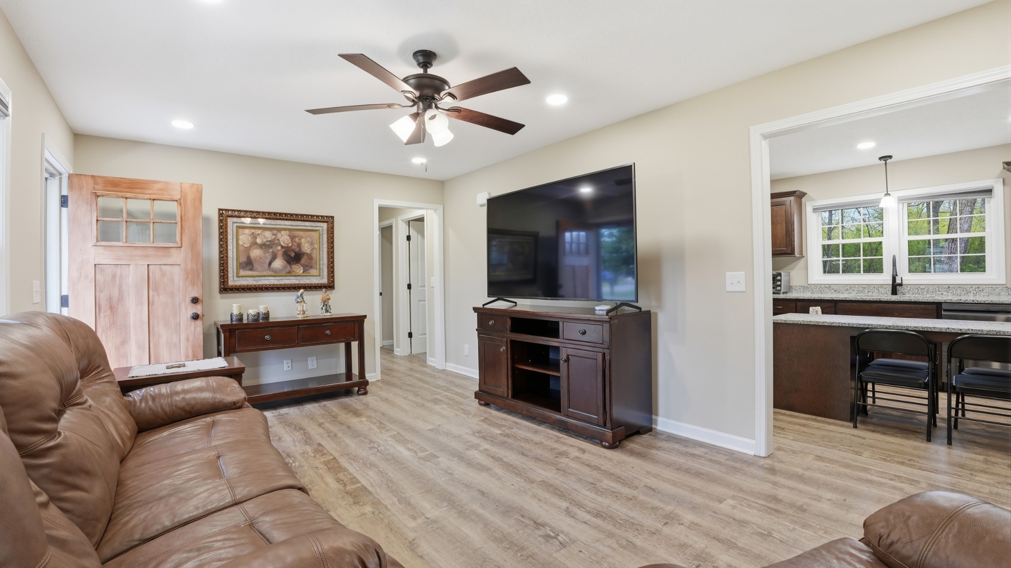 606 Rickenbacker Drive Tullahoma, TN 37388 - Photo 8 of 38 a living room with furniture and a flat screen tv