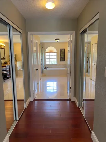 a view of an entryway with wooden floor