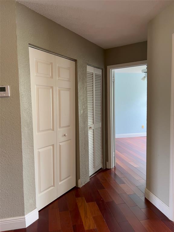 1423 Southwest 158th Avenue Pembroke Pines, FL 33027 - Photo 26 of 43 an empty room with wooden floor and closet area