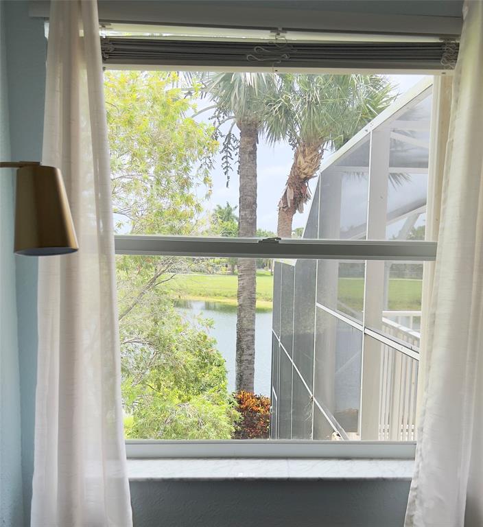 1423 Southwest 158th Avenue Pembroke Pines, FL 33027 - Photo 27 of 43 a view of a room that has a large window and wooden floor