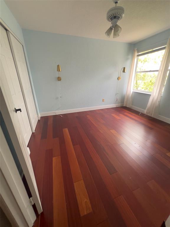 1423 Southwest 158th Avenue Pembroke Pines, FL 33027 - Photo 29 of 43 wooden floor in an empty room with a window