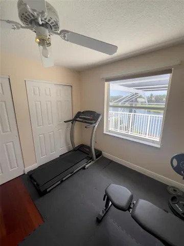 a room with gym equipment and a window