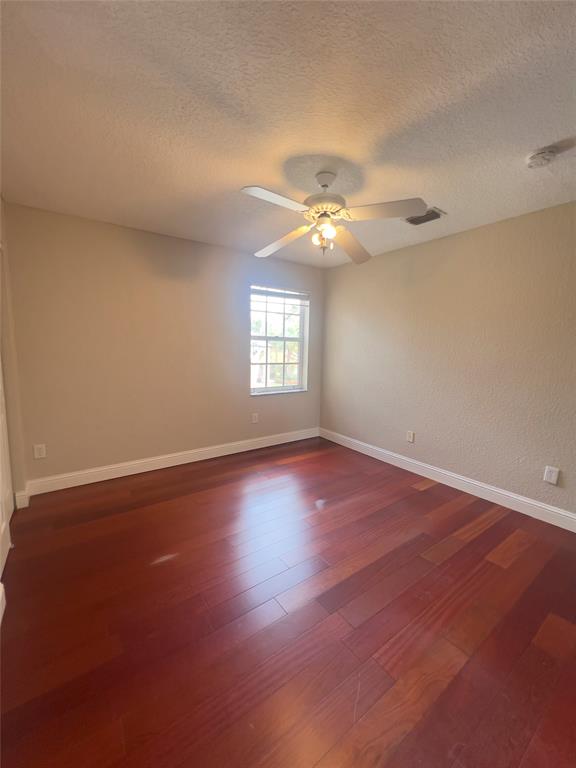 1423 Southwest 158th Avenue Pembroke Pines, FL 33027 - Photo 36 of 43 an empty room with wooden floor and windows