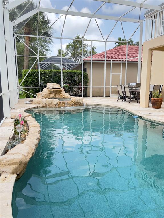 1423 Southwest 158th Avenue Pembroke Pines, FL 33027 - Photo 4 of 43 a view of a swimming pool with a patio