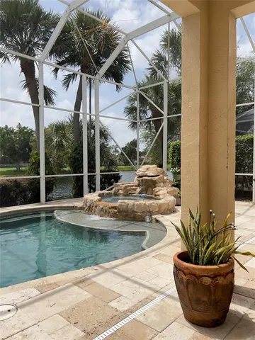 a view of a swimming pool with a patio