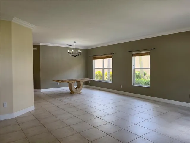 a view of an empty room with windows