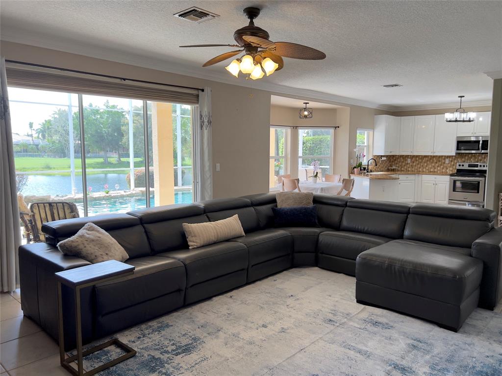 1423 Southwest 158th Avenue Pembroke Pines, FL 33027 - Photo 7 of 43 a living room with furniture and a large window