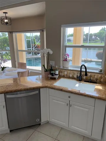 a kitchen with sink and window
