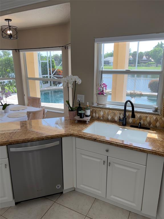 1423 Southwest 158th Avenue Pembroke Pines, FL 33027 - Photo 9 of 43 a kitchen with sink and window