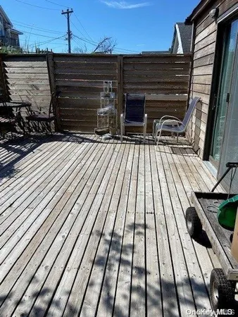 a view of outdoor space with wooden floor