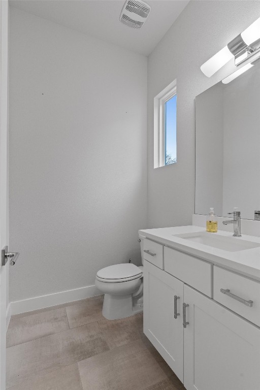 5002 Pecan Springs Road, Unit 1 Austin, TX 78723 - Photo 22 of 38 Half bathroom featuring vanity and toilet