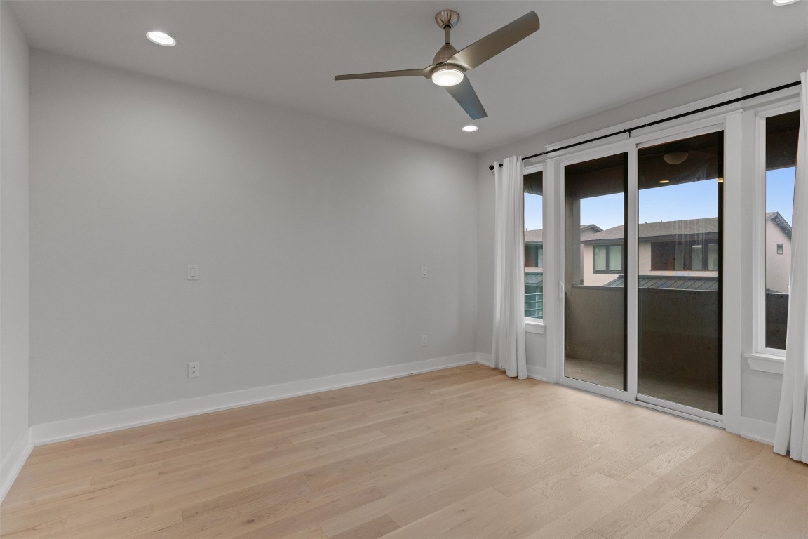 5002 Pecan Springs Road, Unit 1 Austin, TX 78723 - Photo 24 of 38 Unfurnished room with light wood-style floors, a ceiling fan, and recessed lighting