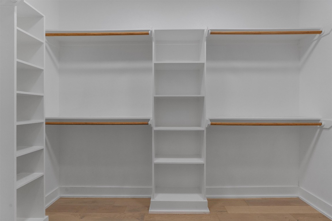 5002 Pecan Springs Road, Unit 1 Austin, TX 78723 - Photo 29 of 38 Walk in closet featuring light wood-style flooring