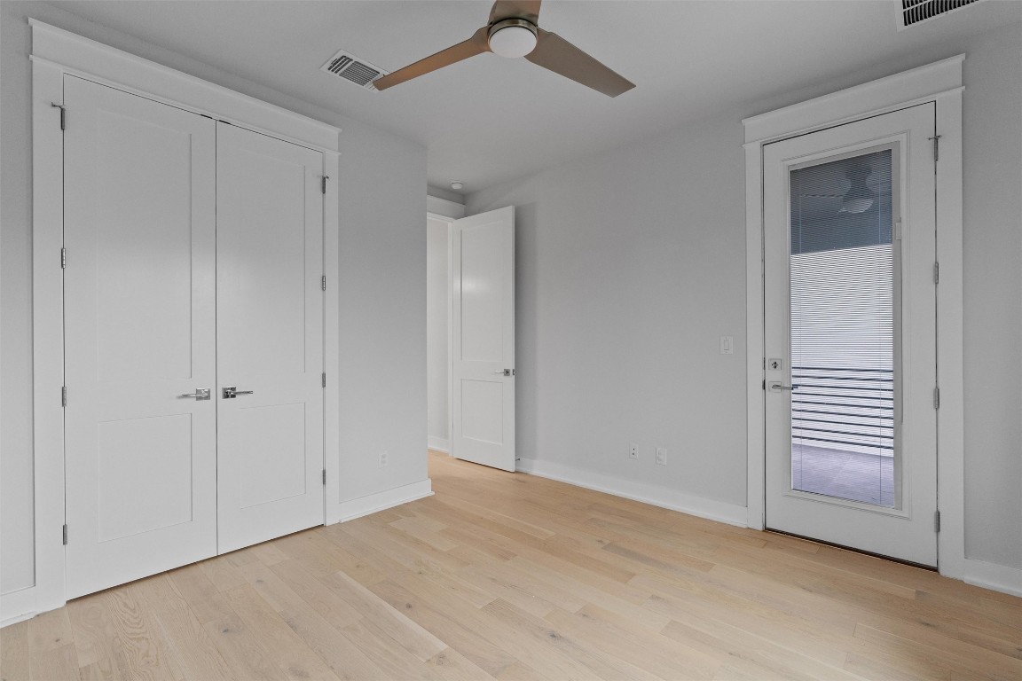5002 Pecan Springs Road, Unit 1 Austin, TX 78723 - Photo 33 of 38 Unfurnished bedroom with light wood-style floors and ceiling fan