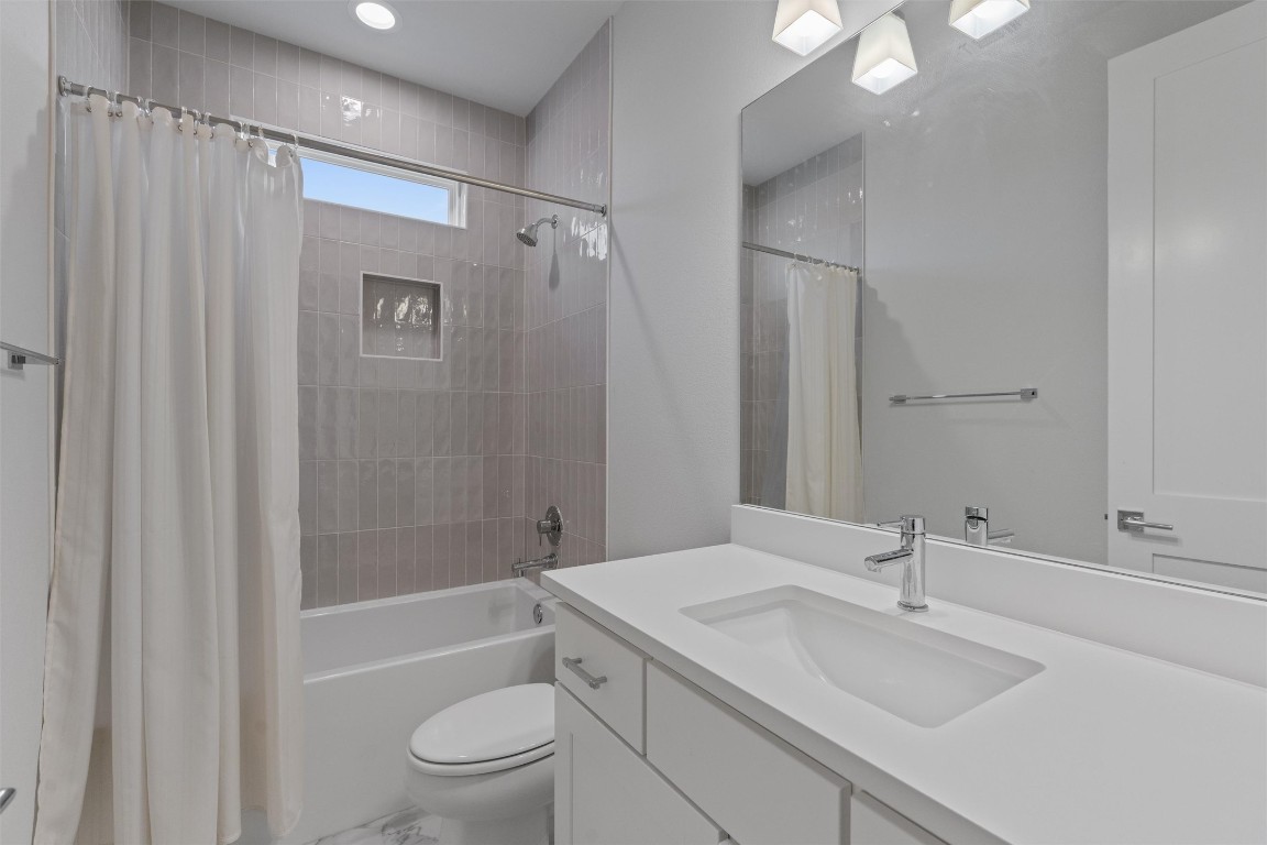 5002 Pecan Springs Road, Unit 1 Austin, TX 78723 - Photo 34 of 38 Full bath with shower / bath combo and vanity