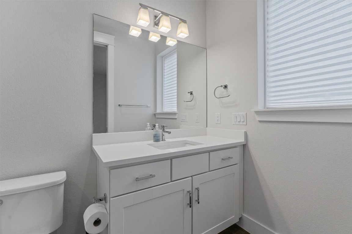 5002 Pecan Springs Road, Unit 1 Austin, TX 78723 - Photo 8 of 38 Bathroom featuring a textured wall and vanity