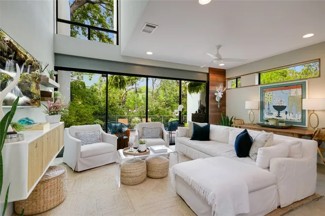 a living room with furniture and a large window
