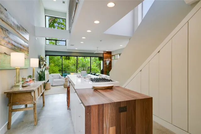 a kitchen with a table chairs and window