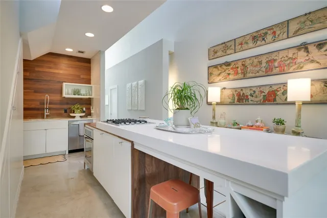 a kitchen with a sink cabinets and window