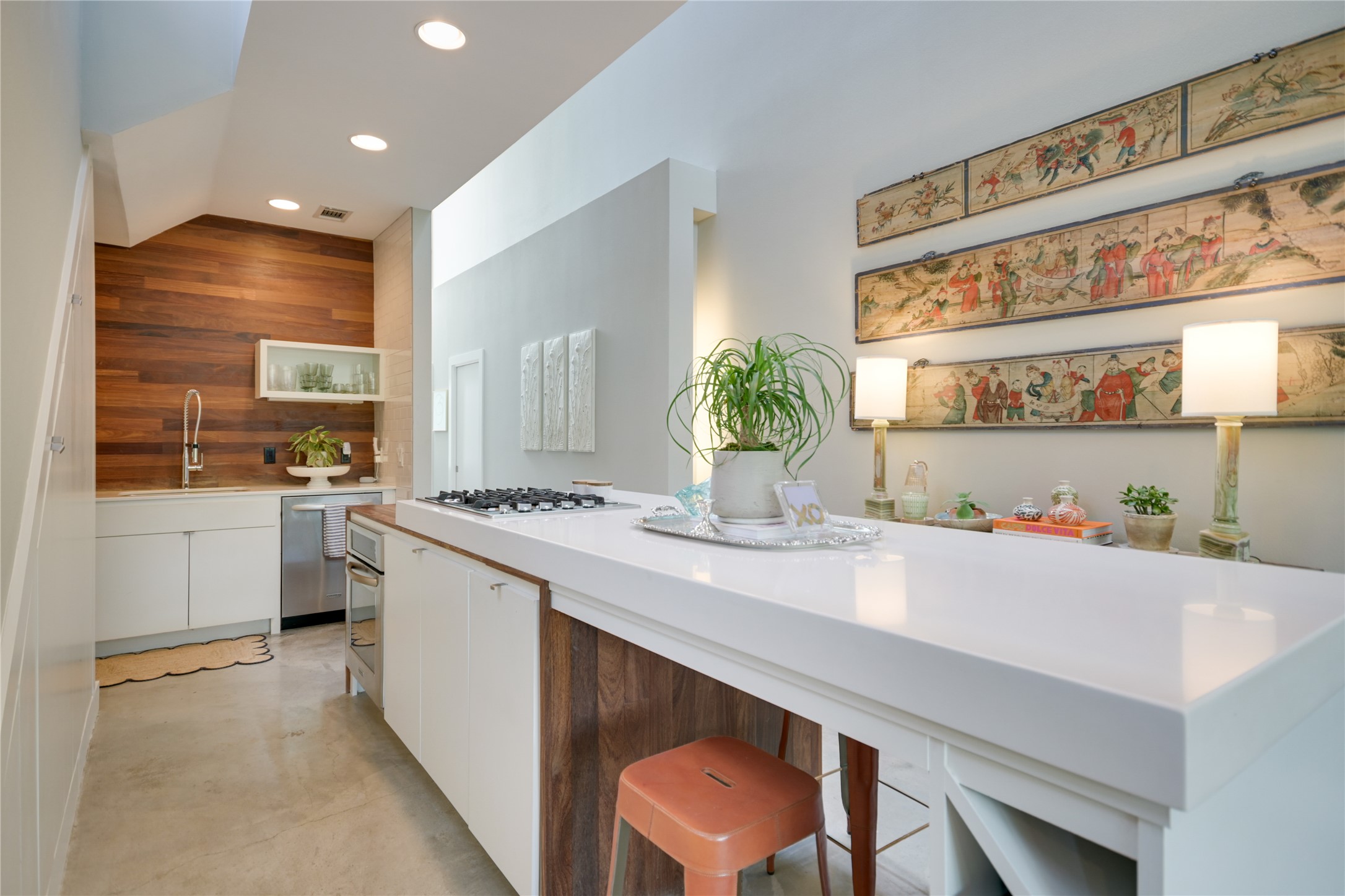 1715 Giles Street, Unit A Austin, TX 78722 - Photo 3 of 24 A smartly laid-out kitchen offers plenty of space for both cooking and gathering, and it seamlessly flows into the living room.