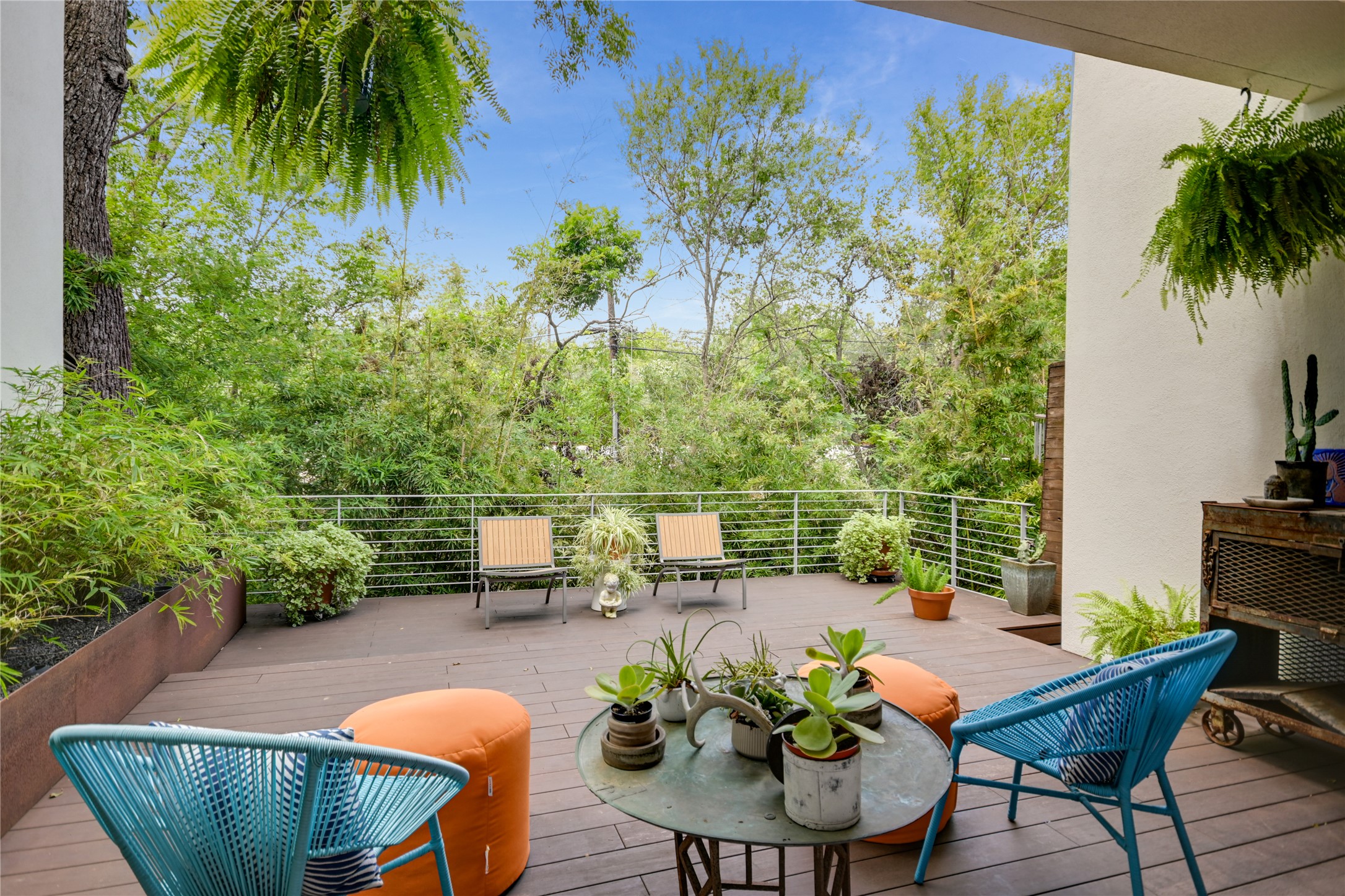 1715 Giles Street, Unit A Austin, TX 78722 - Photo 4 of 24 An oversized Ipe deck extends the living space both visually and practically, allowing you to enjoy being surrounded by nature, whether inside or out.