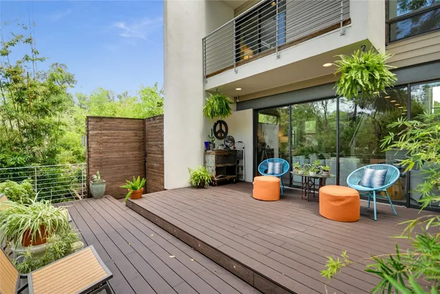 a wooden bench sitting in front of a building