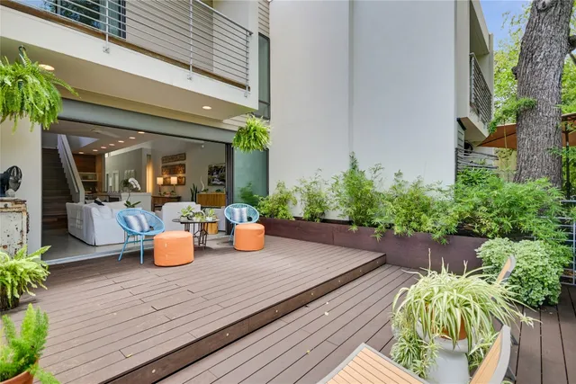 a view of a dining table and chairs in patio of the house
