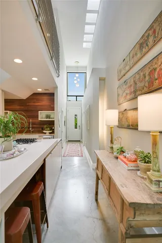 a kitchen with stainless steel appliances kitchen island granite countertop a sink and cabinets
