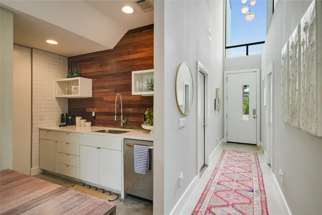 a en suite bathroom with a sink mirror and shower