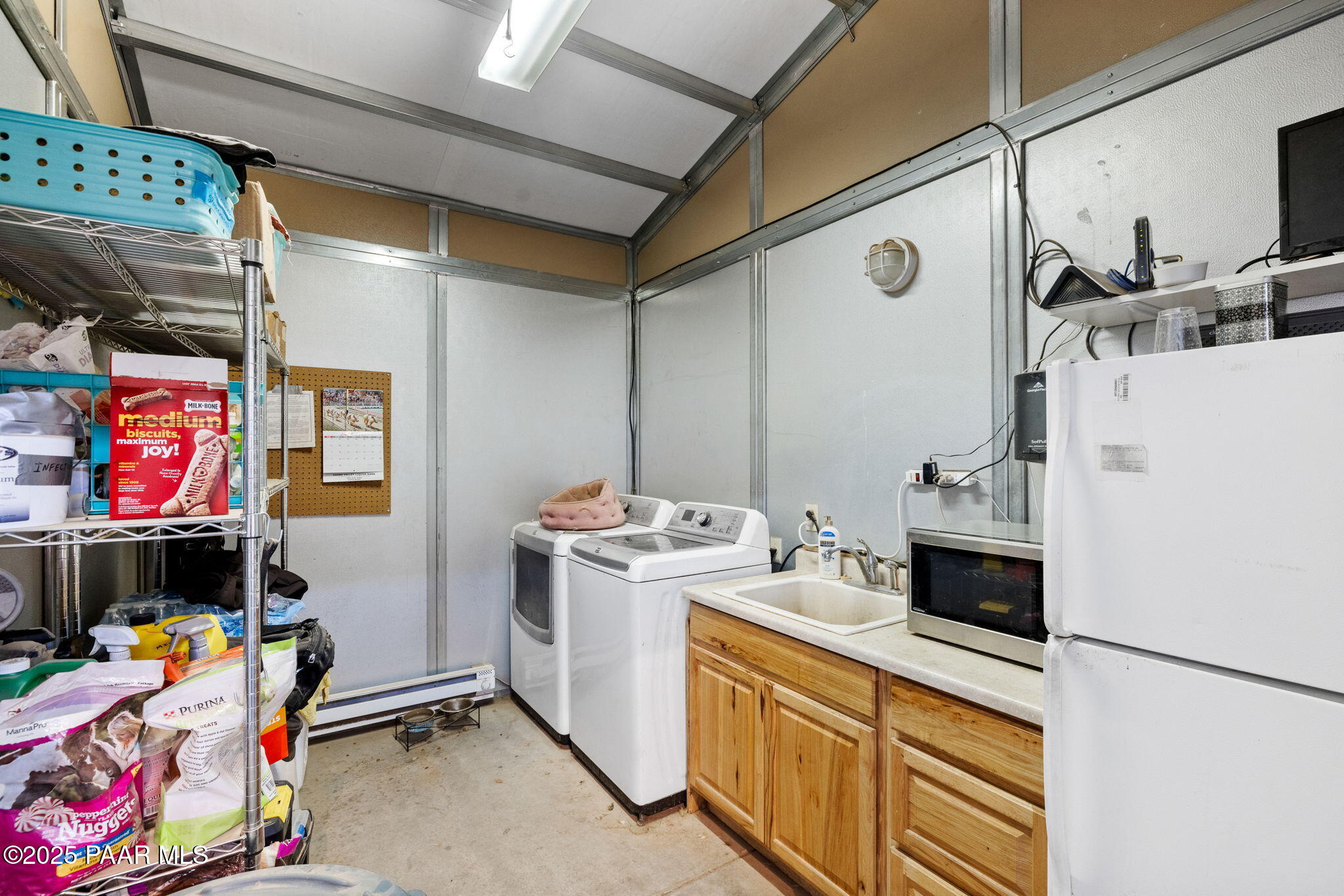 13225 North Bull Run Road Prescott, AZ 86305 - Photo 26 of 76 a storage room with washer and dryer
