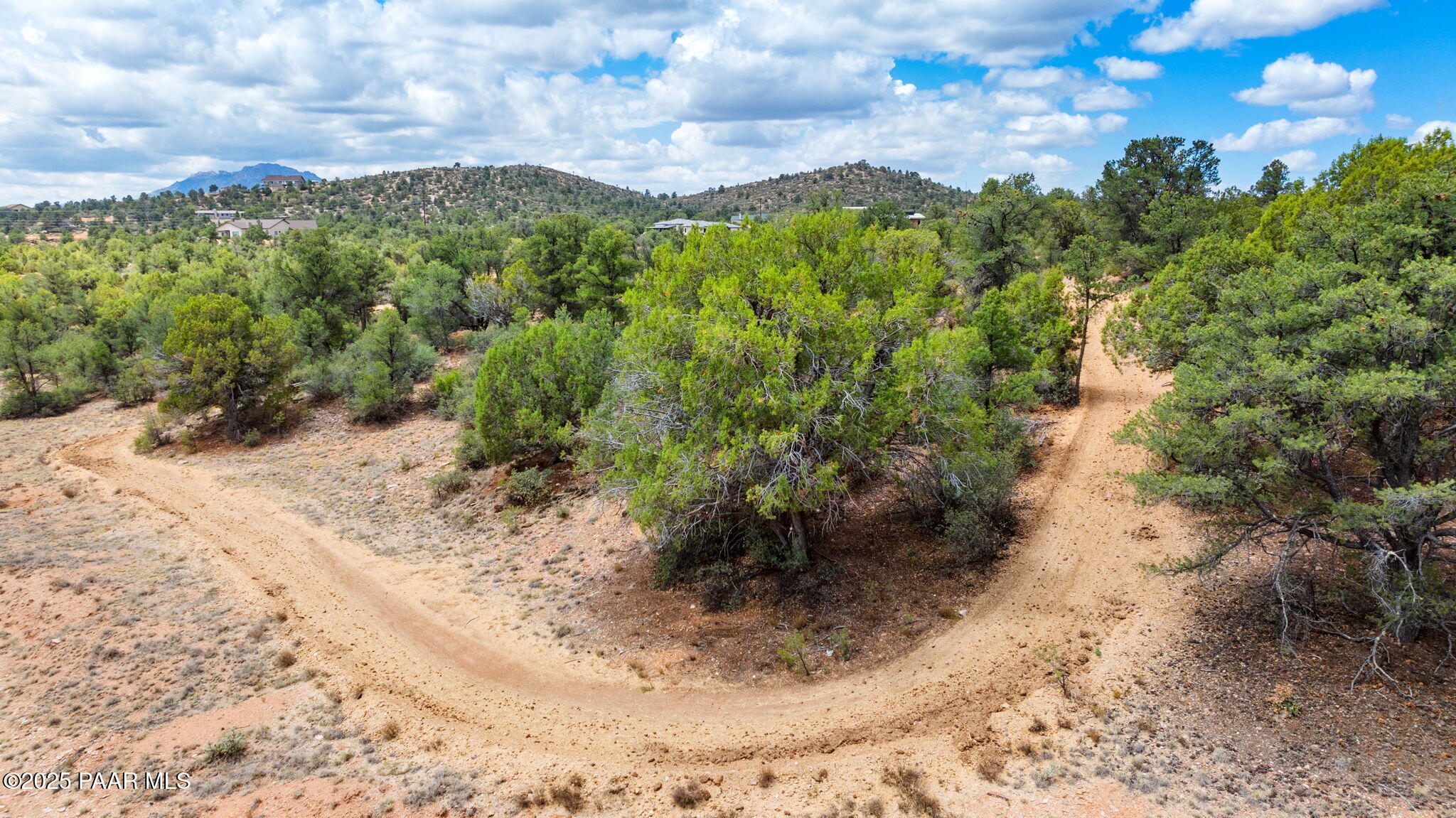 13225 North Bull Run Road Prescott, AZ 86305 - Photo 30 of 76 a view of a yard with plants and a bench