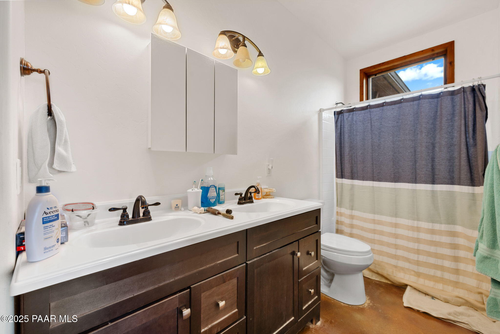 13225 North Bull Run Road Prescott, AZ 86305 - Photo 72 of 76 a bathroom with a sink a toilet and mirror