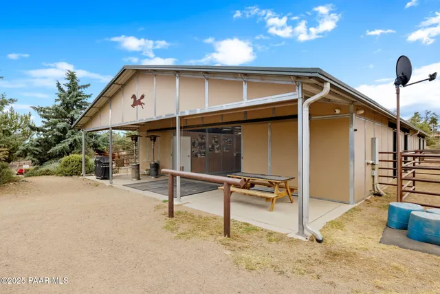 a view of empty room with wooden walls