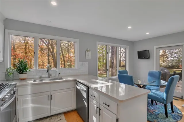 a kitchen with a sink and large window