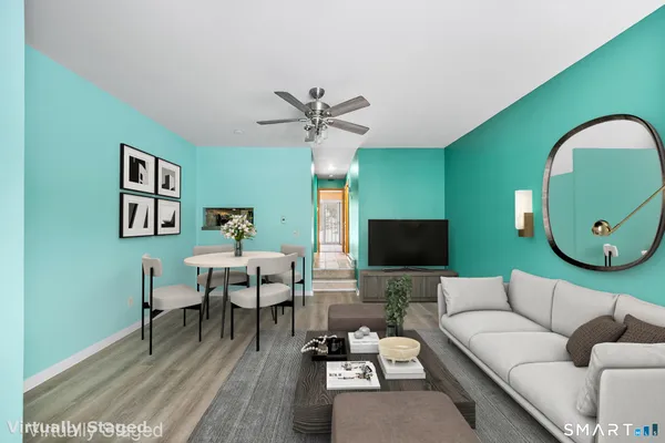 a living room with furniture and a flat screen tv