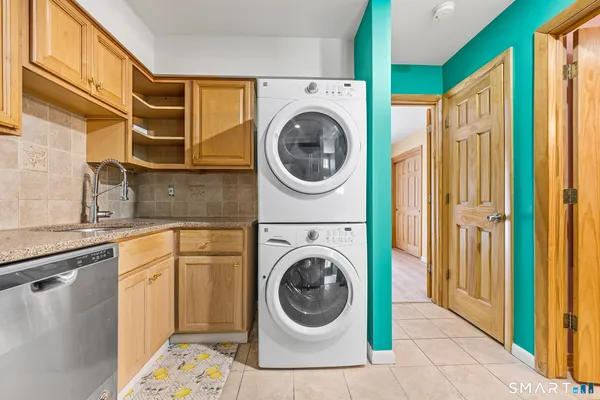 a view of a hallway with washer and dryer