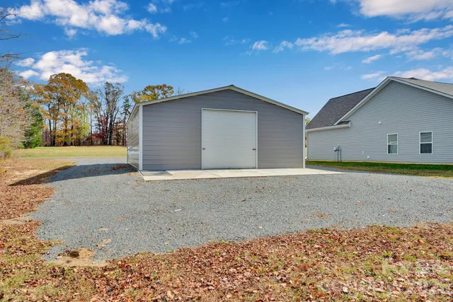 a view of a backyard of the house