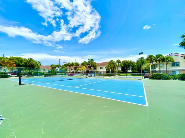 a view of a playground with basketball court