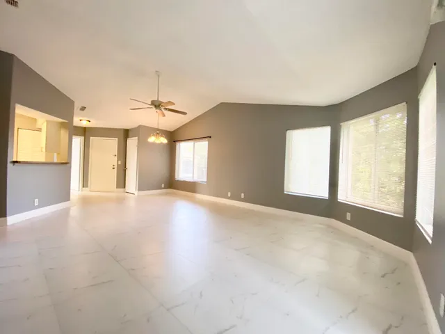 a view of an empty room with a window