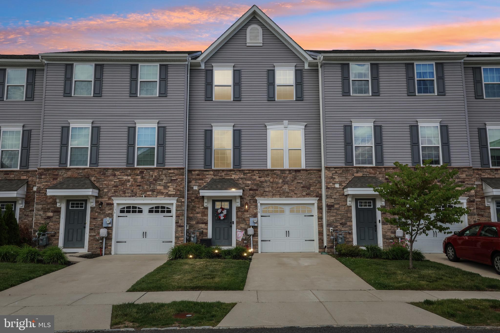 138 Pinnacle Place Sewell, NJ 08080 - Photo 1 of 52 a front view of a house with a garden