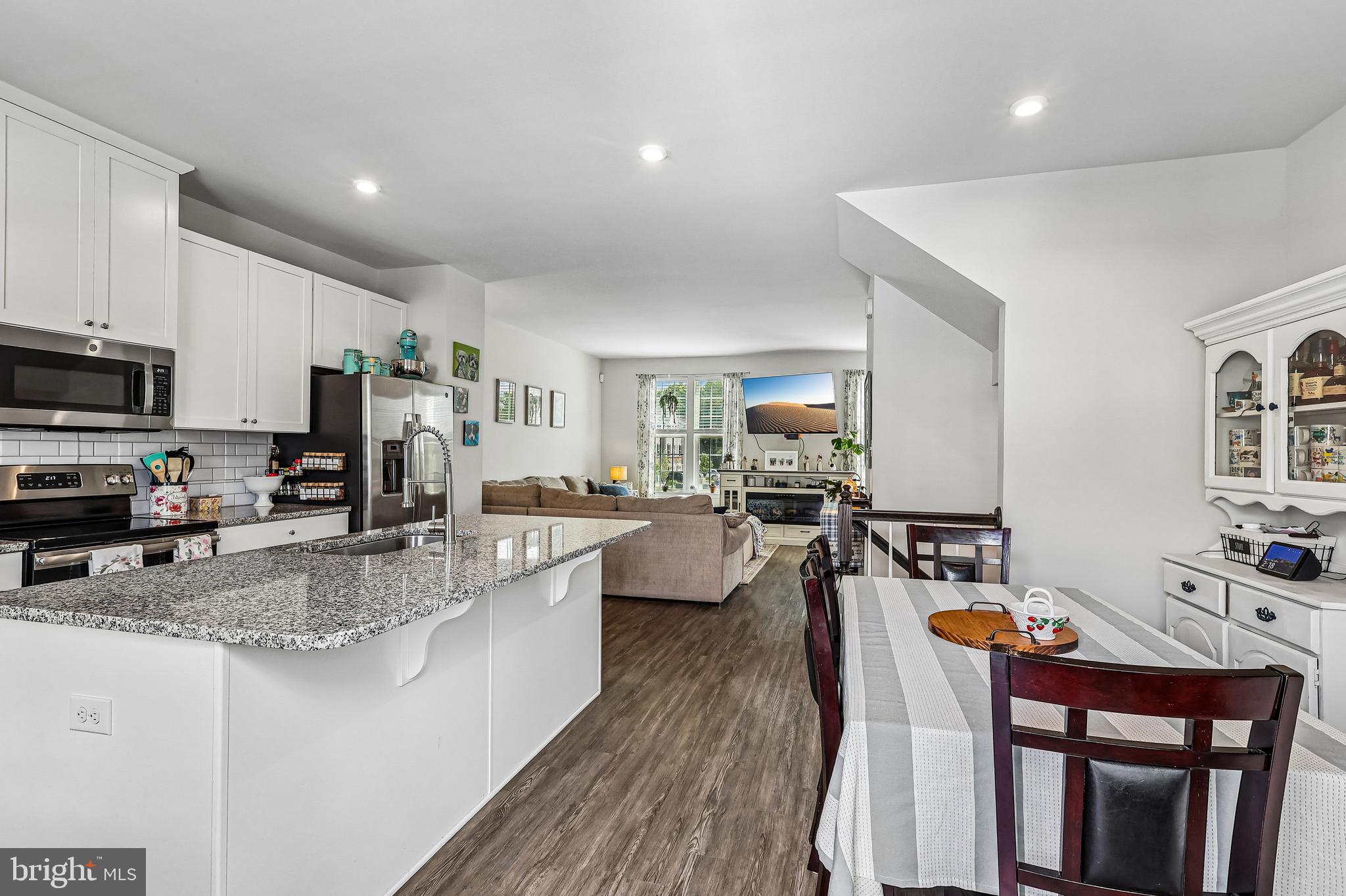 138 Pinnacle Place Sewell, NJ 08080 - Photo 2 of 52 a large kitchen with sink a counter top space stainless steel appliances and dining table