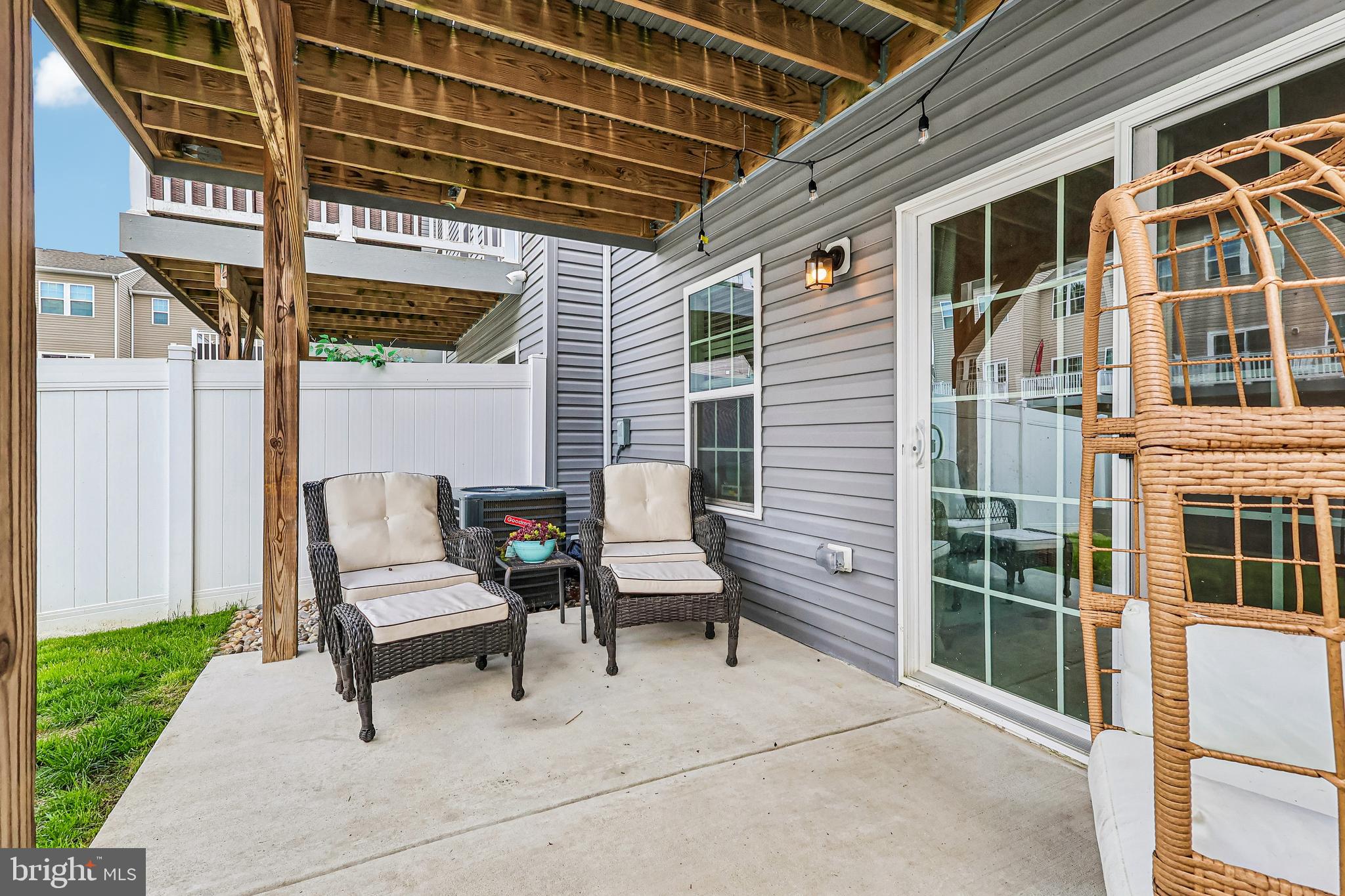 138 Pinnacle Place Sewell, NJ 08080 - Photo 41 of 52 a view of a patio with table and chairs with wooden floor and fence