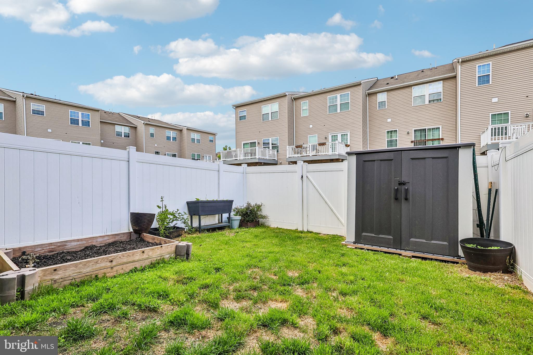 138 Pinnacle Place Sewell, NJ 08080 - Photo 44 of 52 a view of a patio with table and chairs and wooden fence