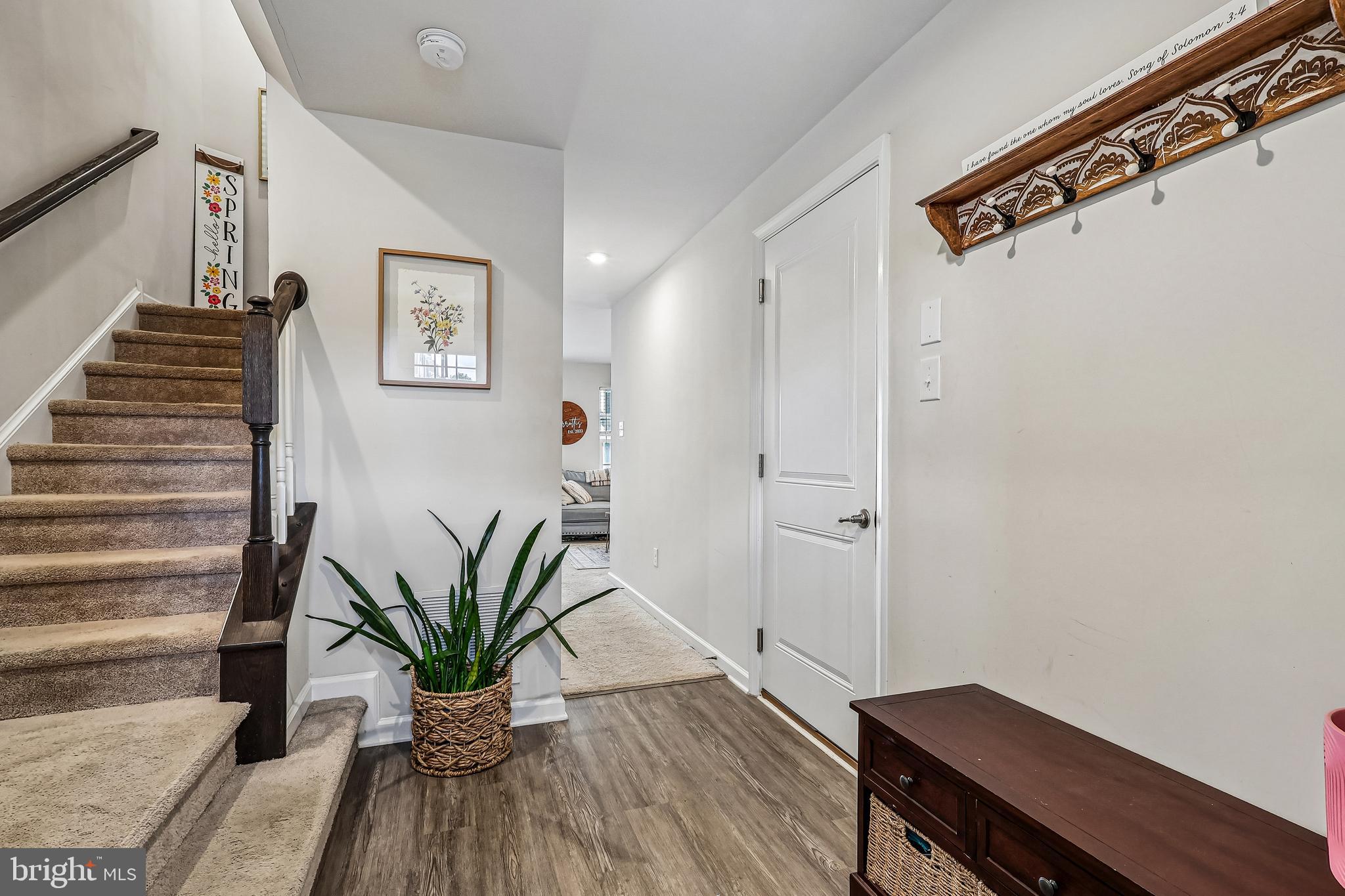 138 Pinnacle Place Sewell, NJ 08080 - Photo 8 of 52 a view of a hallway with wooden floor and a potted plant