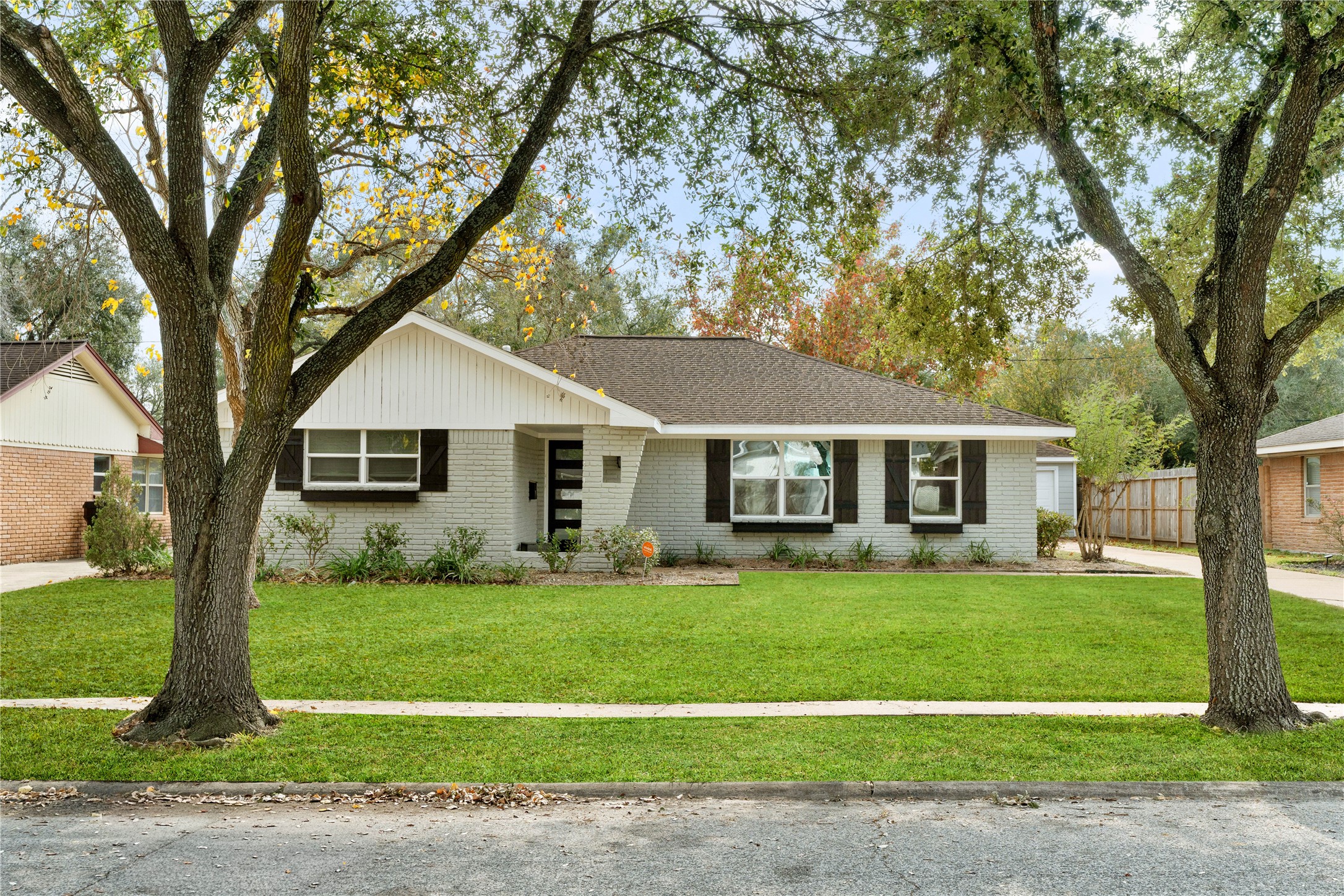 5515 Warm Springs Road Houston, TX 77035 - Photo 1 of 19 a front view of a house with a yard