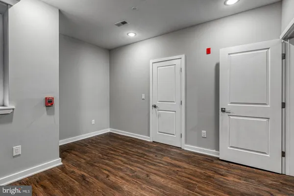 a kitchen with stainless steel appliances granite countertop white cabinets and a stove top oven
