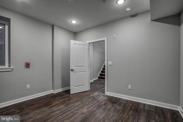 a bathroom with a sink and a large mirror