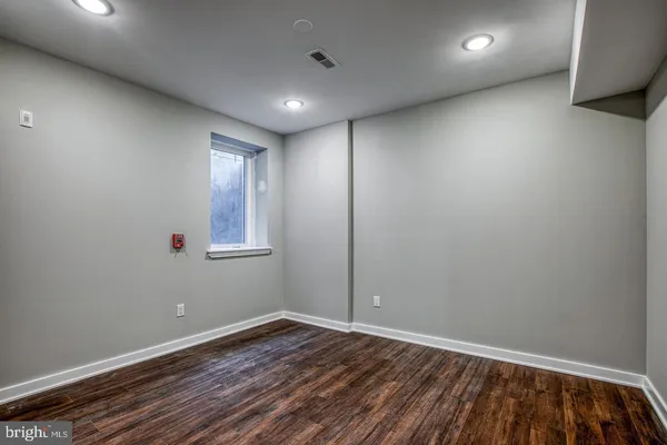 a bathroom with a sink vanity and a mirror