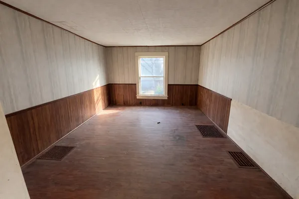 a view of empty room with windows